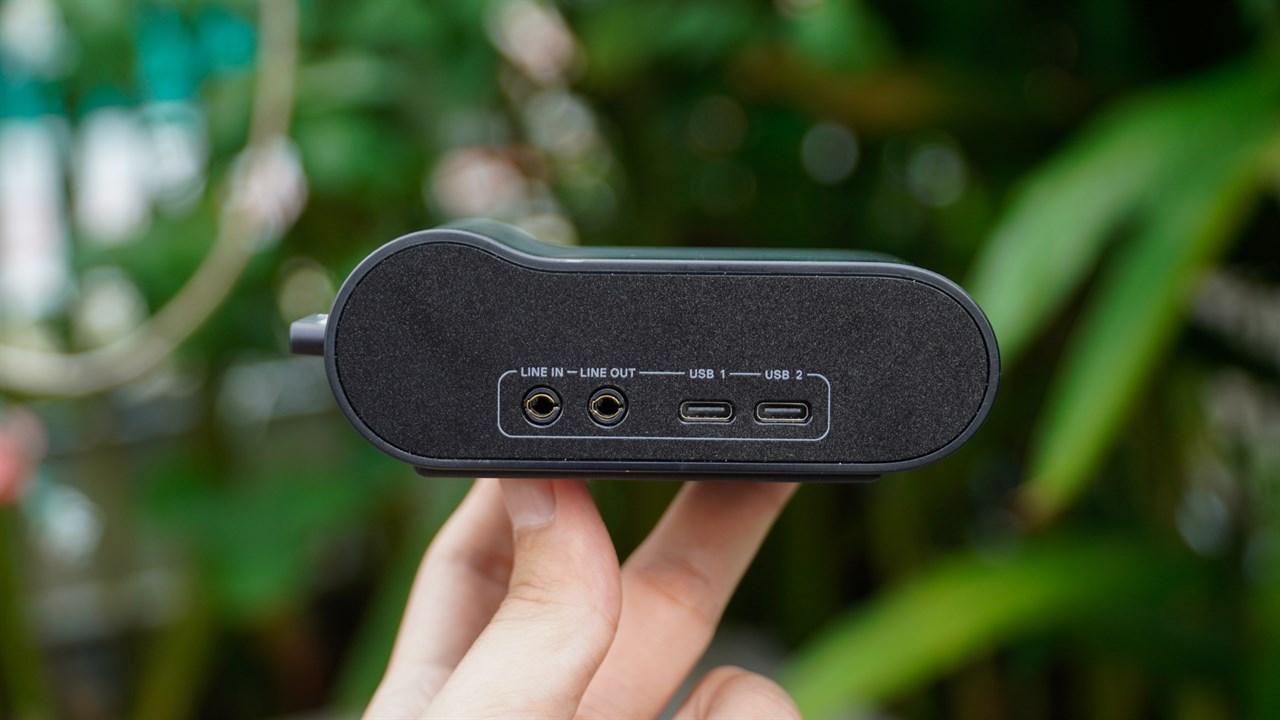 The back of the Wireless Base Station contains 2 audio output ports and 2 USB-C ports.